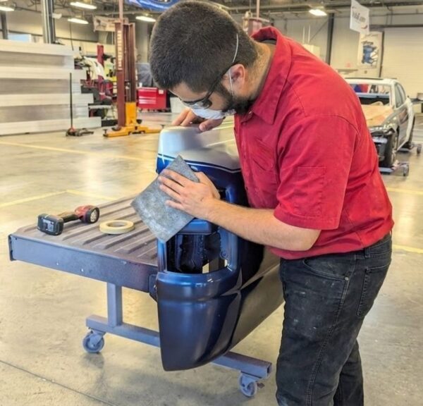 Lake Bluff Auto Body Shop tech working on a bedside collision repair