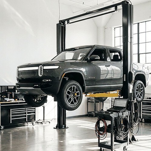 Rivian on lift getting serviced-Collision repair services