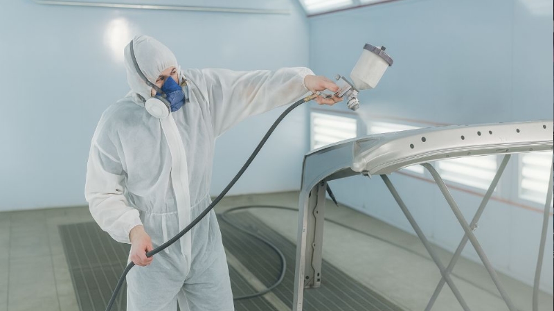 Highland Park Certified Collision Repair painter spraying bumper Highland Park Certified Collision Repair painter spraying bumper